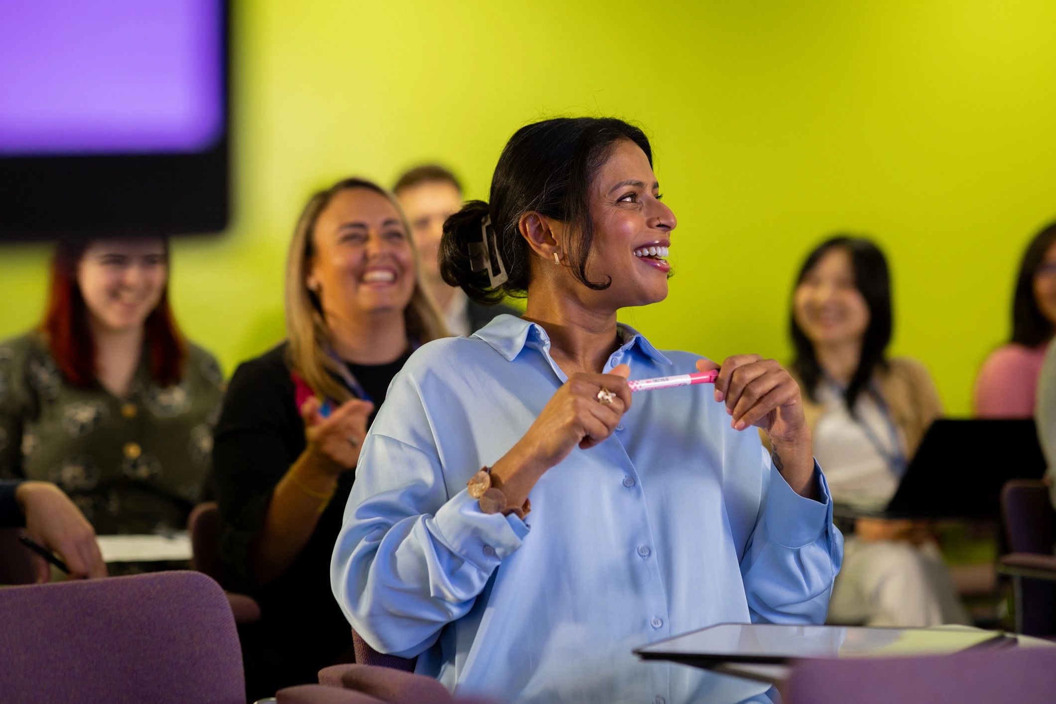 Audience attending a professional conference session