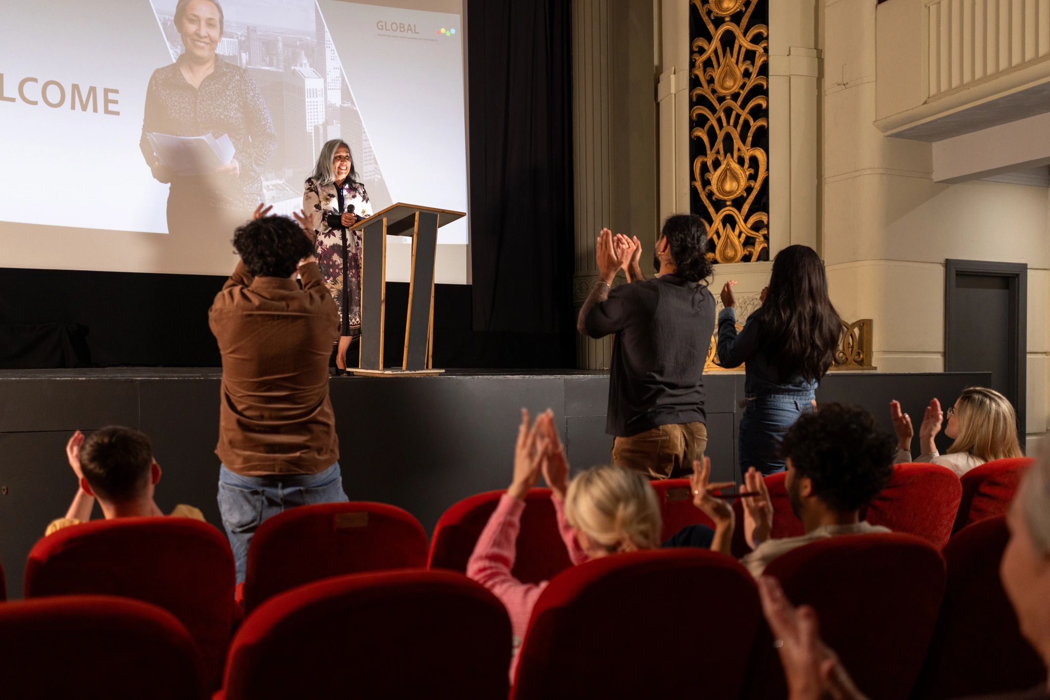 Professional speaker on stage during an awards event